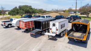 trailer lineup at Austin trailer rental lot showing multiple trailer types for contractors