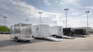 enclosed cargo trailers lined up at trailer rental lot in Austin Texas for pickup and delivery