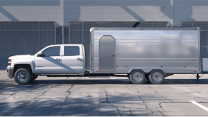 pickup truck towing enclosed cargo trailer showing proper towing setup and hitch alignment